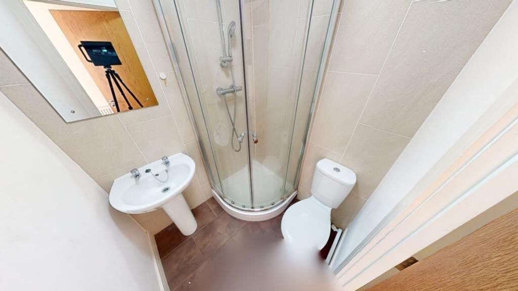 Property photo 1 of 11 A Compact And Tidy Bathroom Featuring A Curved Gla...