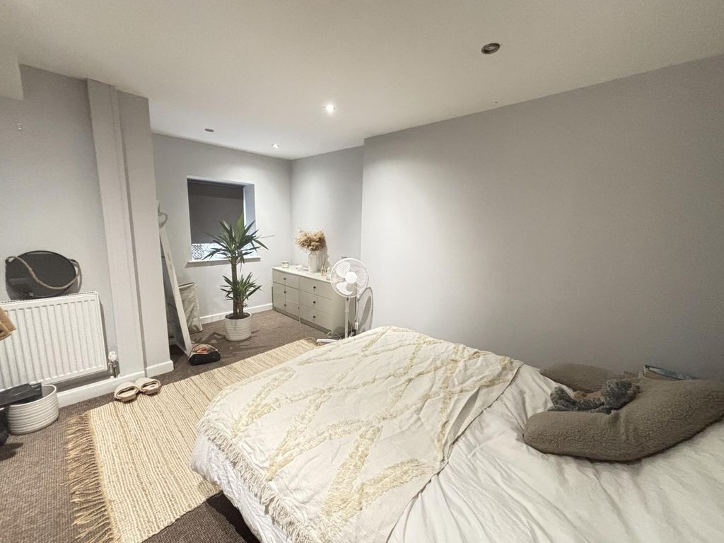 Property photo 1 of 39 A Bright And Cozy Bedroom Featuring A Comfortable ...