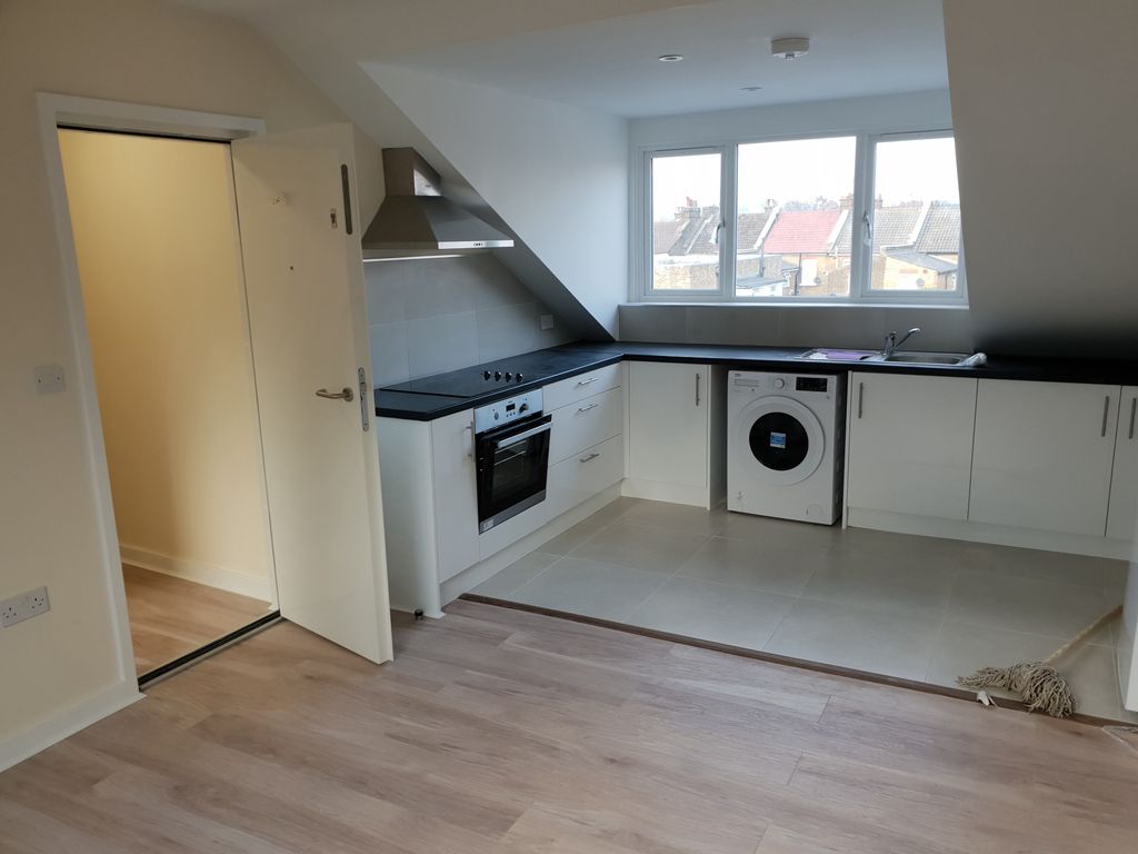 Property photo 1 of 4 Bright And Clean Modern Kitchen Featuring Sleek Wh...