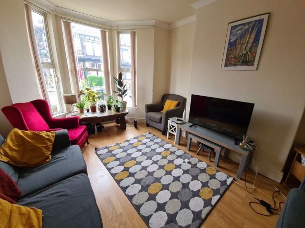 Property photo 1 of 9 A Bright And Inviting Living Room Featuring A Larg...