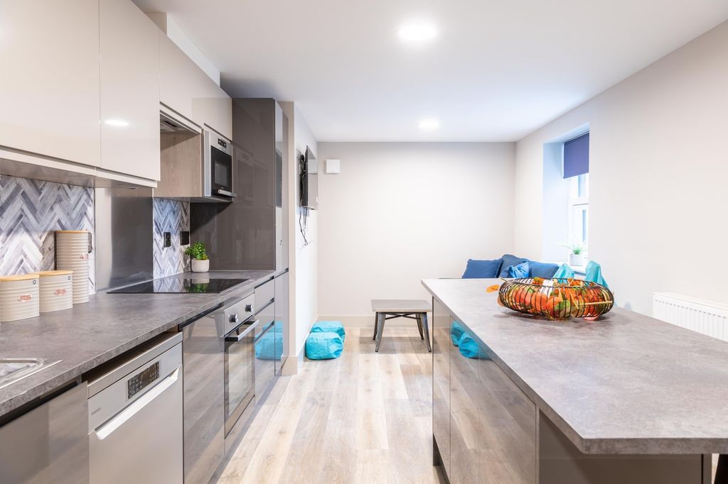 Property photo 1 of 7 Modern And Bright Kitchen With Sleek Cabinetry, Am...
