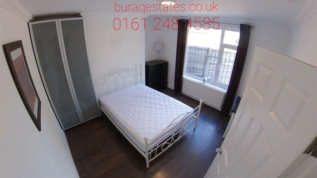 Property photo 1 of 12 Bright And Inviting Master Bedroom Featuring A Com...