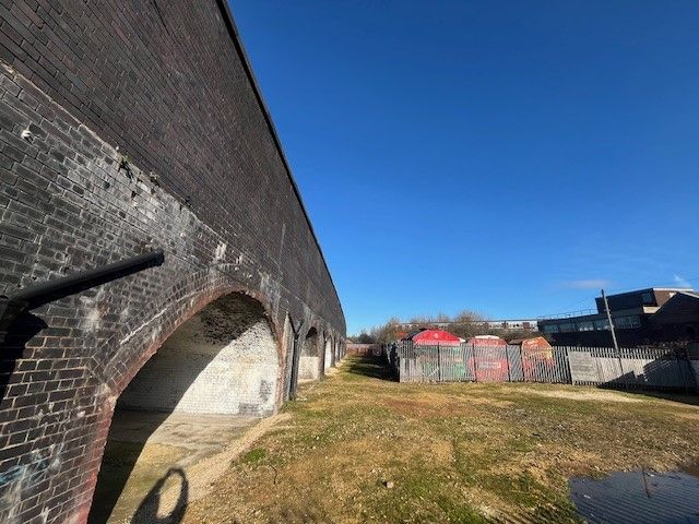 Property photo 3 of 3 An Open Yard With Metal Fencing Around It.