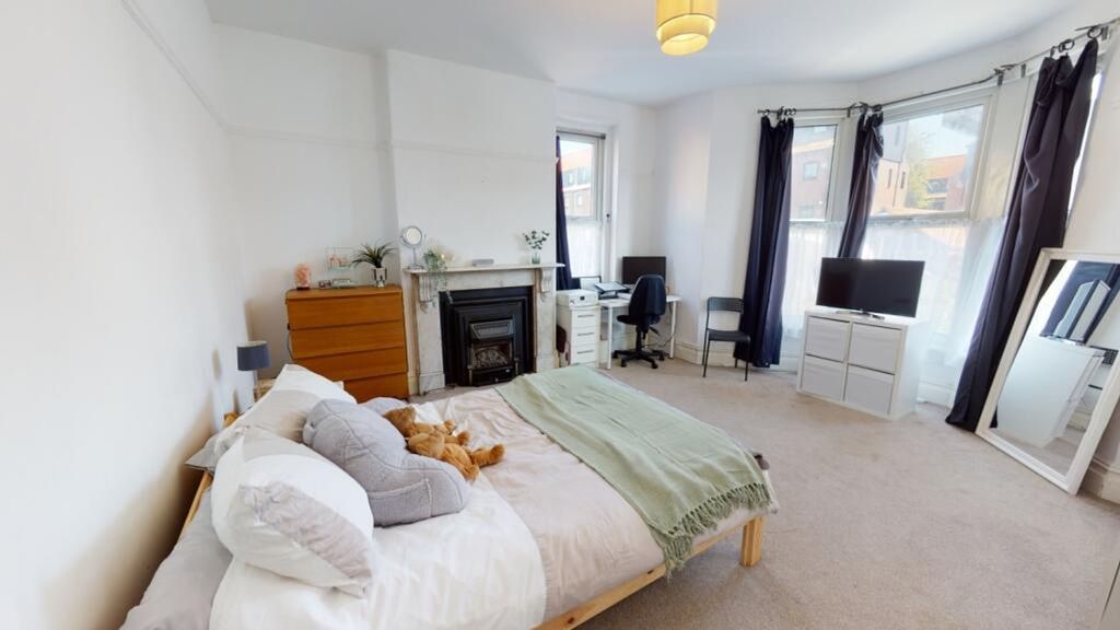 Property photo 1 of 15 Spacious Master Bedroom Featuring A Cozy Double Be...