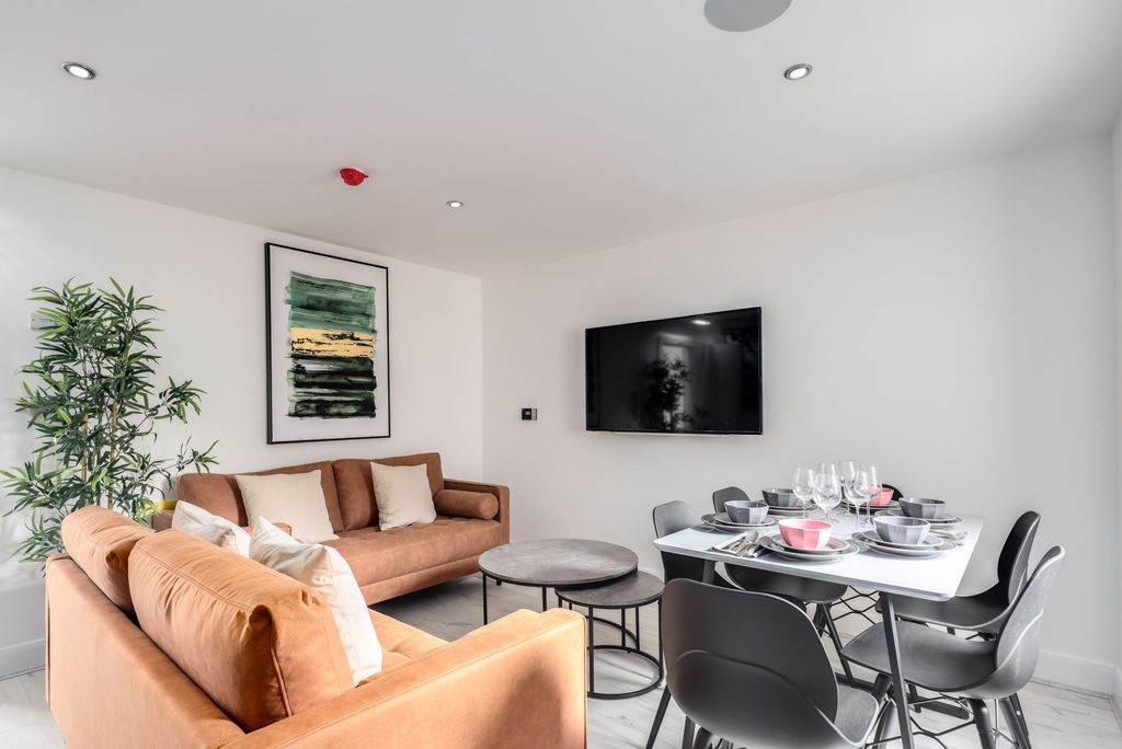 Property photo 2 of 5 A Modern And Inviting Living Room Featuring Stylis...