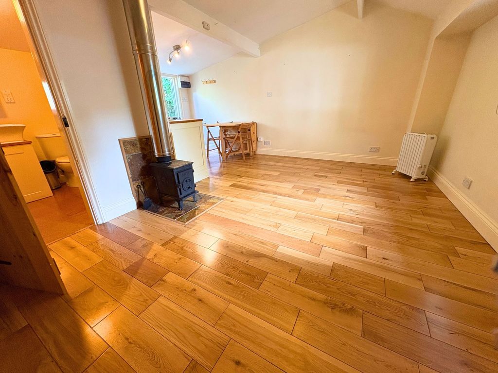 Property photo 3 of 9 Living Area With Wood-Burning Stove