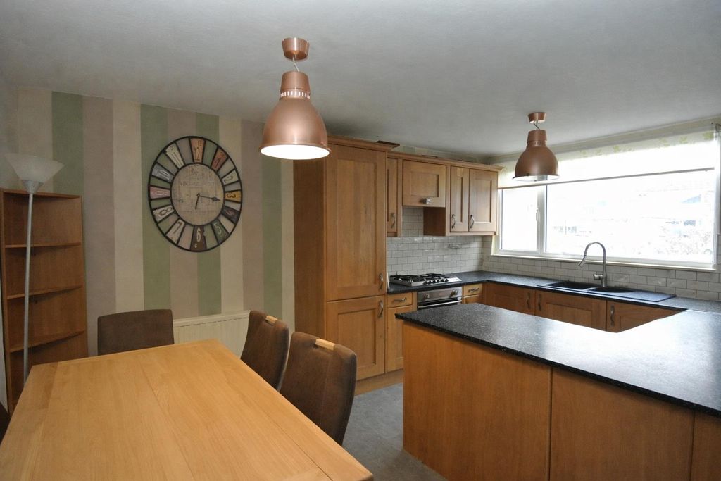 Property photo 2 of 17 Modern Kitchen And Cozy Dining Area.Png