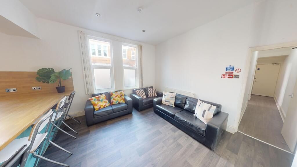 Property photo 3 of 15 Bright And Contemporary Living Room Featuring Comf...