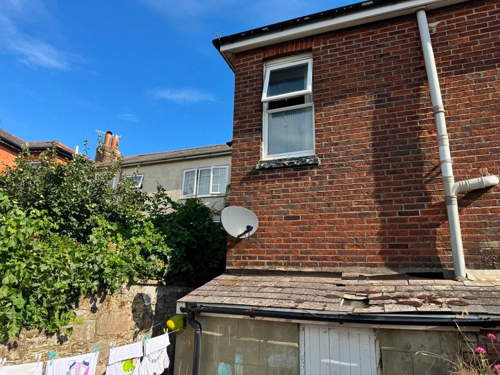 Property photo 2 of 6 Rear Elevation View With Brick Exterior