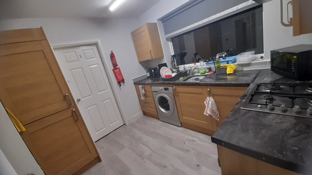 Property photo 1 of 8 Bright, Modern Kitchen With Wood-Effect Cabinets, ...