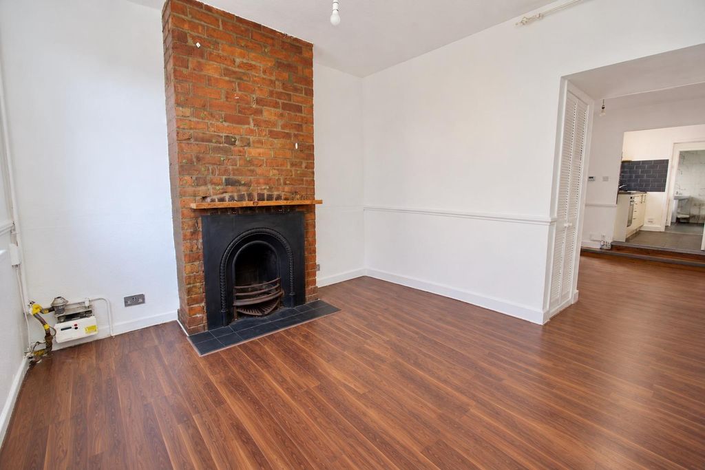 Property photo 3 of 12 Minimalist Brick Fireplace Living Room.Jpeg
