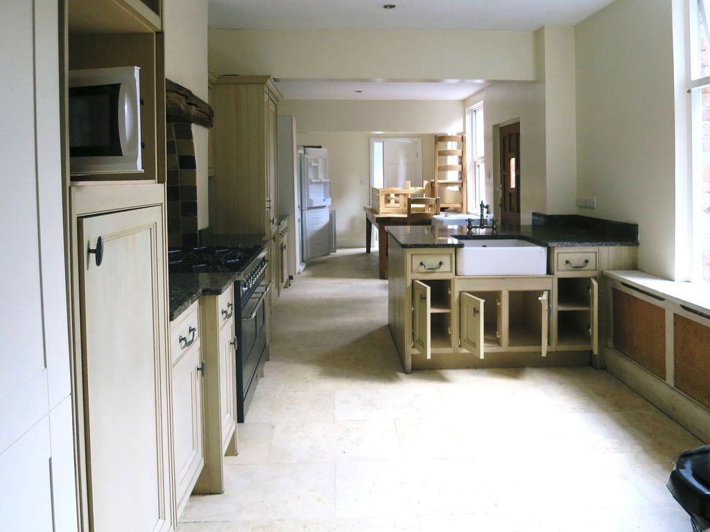 Property photo 1 of 28 A Spacious Kitchen With A Classic Design Featuring...