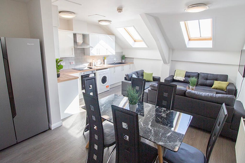 Property photo 2 of 7 This Contemporary Kitchen And Living Area Boasts A...