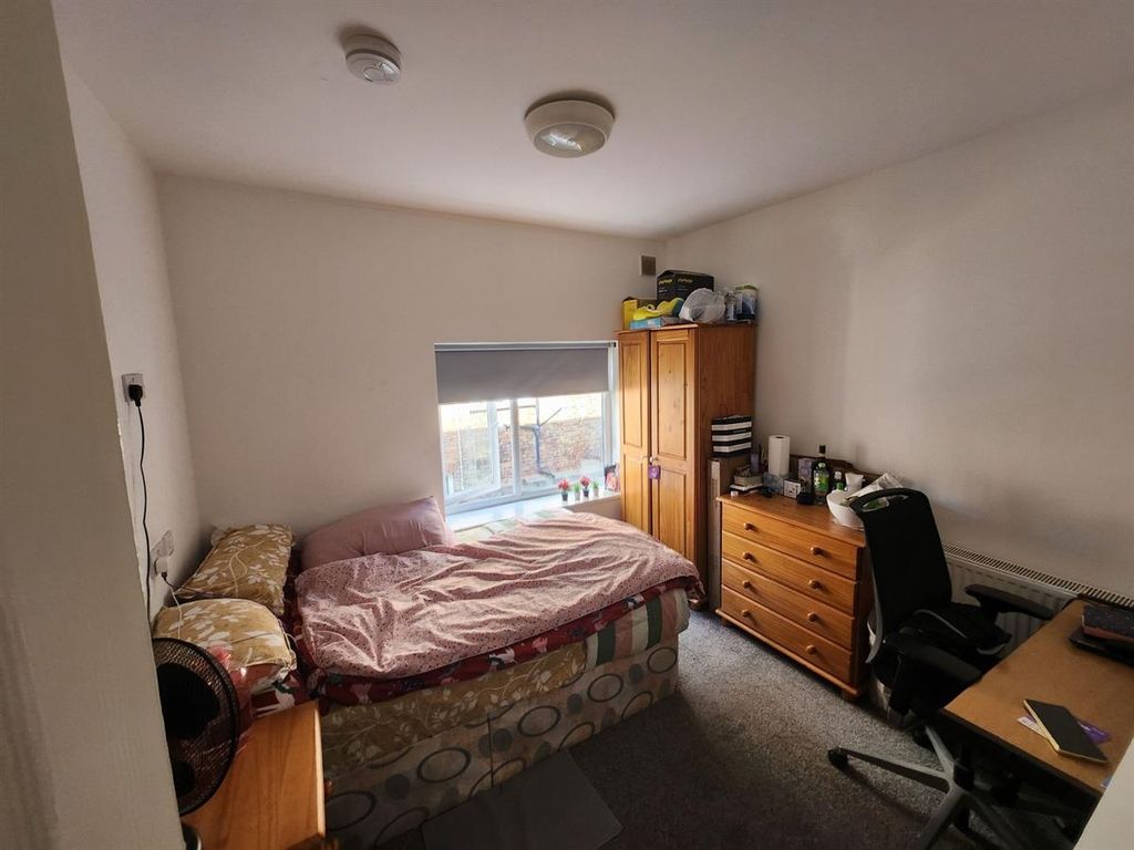 Property photo 1 of 12 A Cozy Bedroom With Natural Light Coming Through A...