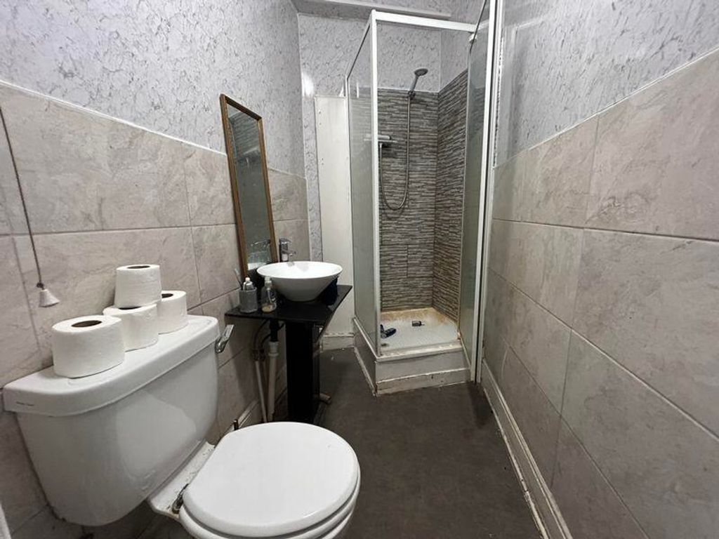 Property photo 2 of 9 A Tidy And Functional Bathroom Featuring A Shower ...