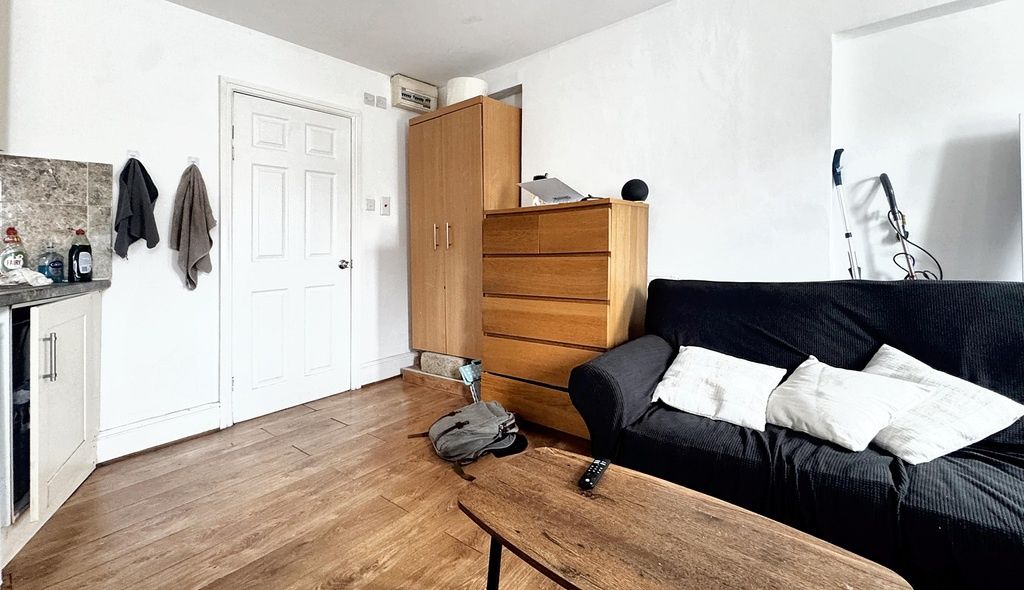 Property photo 3 of 5 Bright Living Area With Comfy Sofa And Storage...