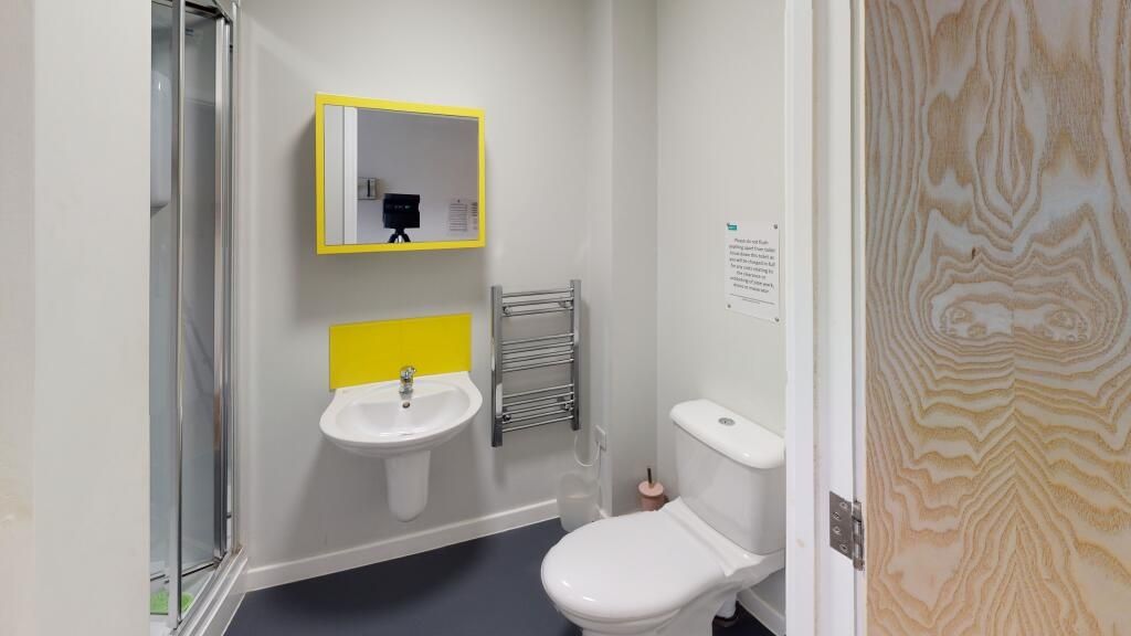 Property photo 2 of 4 A Modern Bathroom Featuring A Clean White Sink Wit...