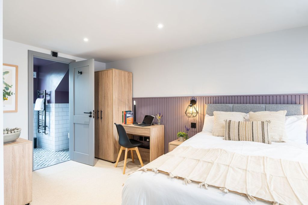 Property photo 1 of 14 Bright And Modern Master Bedroom Featuring A Comfo...