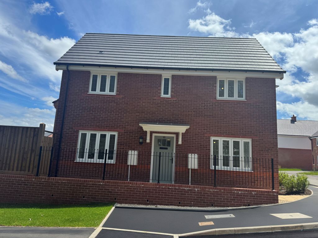 Property photo 1 of 10 A Modern Red Brick House With White-Trimmed Windows Stands Behind A Low Brick Wall And Black Fence