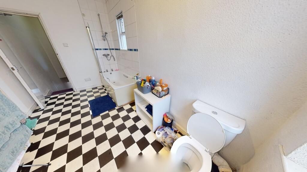 Property photo 3 of 7 Bright And Clean Bathroom Featuring A Classic Blac...