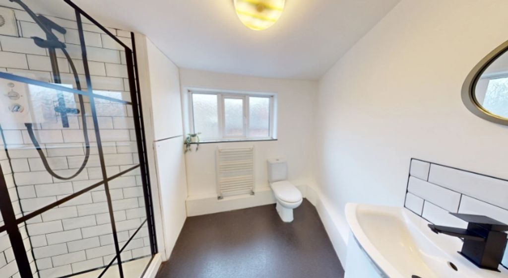 Property photo 1 of 13 A Bright And Modern Bathroom Featuring A Spacious ...