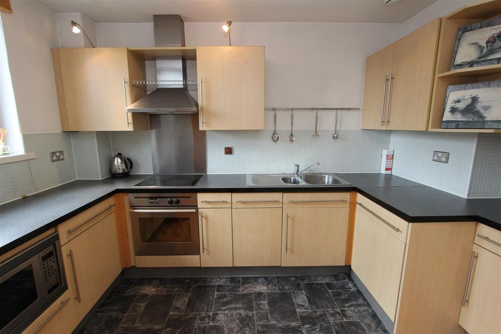 Property photo 3 of 10 Bright Kitchen With Ample Counter Space For Social...