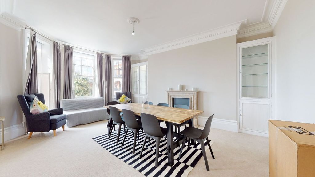 Property photo 3 of 31 A Bright And Spacious Living Room Featuring A Larg...