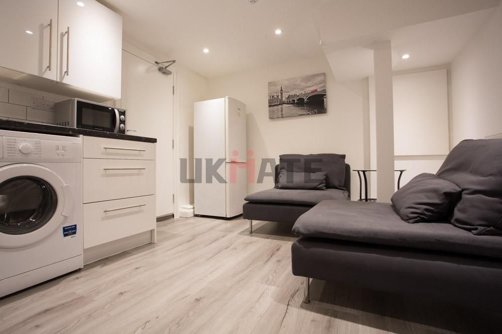 Property photo 2 of 15 A Modern, Well-Lit Living Room Featuring Comfortab...