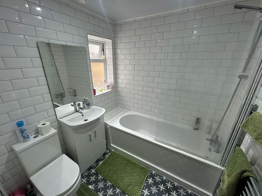 Property photo 3 of 15 Bright And Modern Bathroom Suite Featuring A Clean...