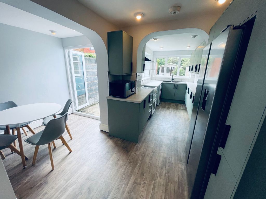 Property photo 1 of 15 Bright, Modern Galley Kitchen With A Stylish Dinin...