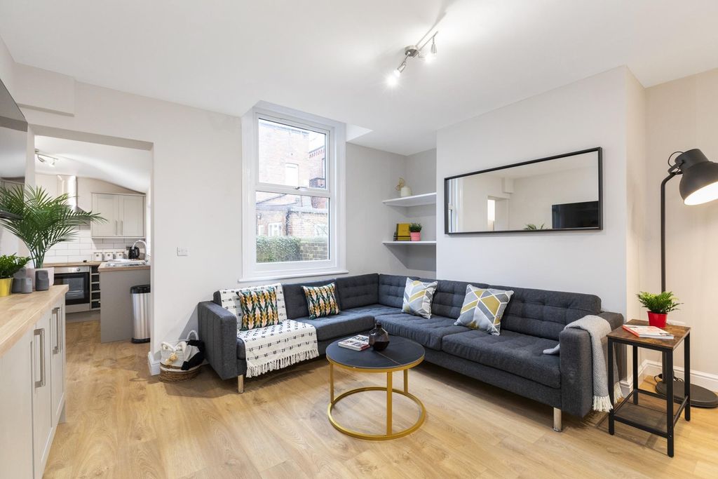 Property photo 1 of 9 Bright, Modern Living Area Featuring A Large L-Sha...