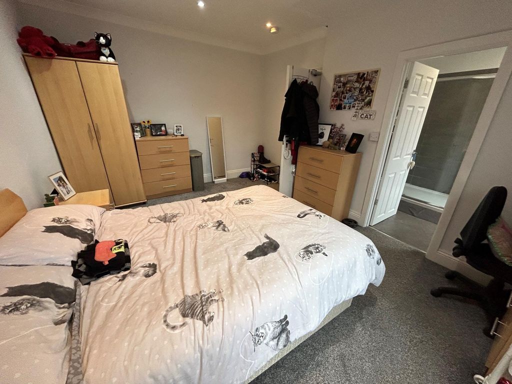 Property photo 3 of 9 A Well-Lit Bedroom Featuring A Large Bed, Wardrobe...