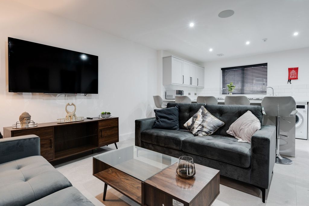 Property photo 2 of 8 Modern And Spacious Living Room Featuring A Large ...