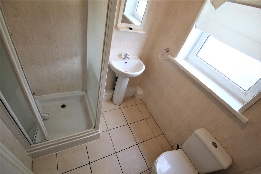 Property photo 1 of 11 Bright And Functional Bathroom Featuring A Shower ...