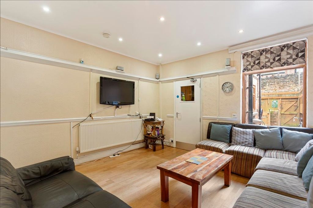 Property photo 2 of 12 A Cozy Living Room Featuring Comfortable Seating, ...