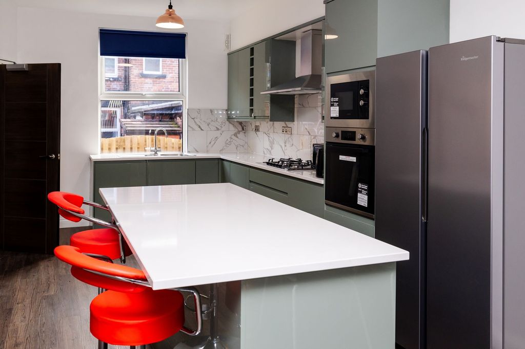 Property photo 2 of 9 Modern Kitchen With A Long White Island Breakfast ...