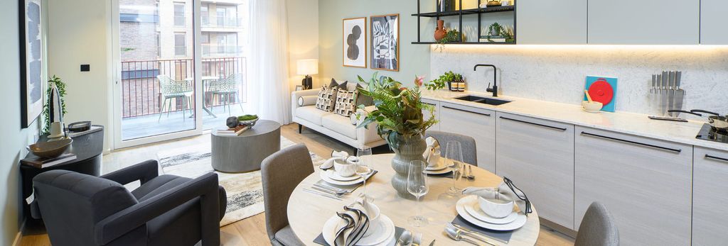 Property photo 1 of 5 Living Space And Dining Table In Foreground With Balcony Access, Kitchenette In Background.