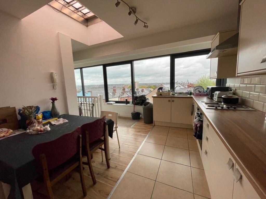 Property photo 2 of 3 Bright Kitchen Space Featuring A Long Countertop W...
