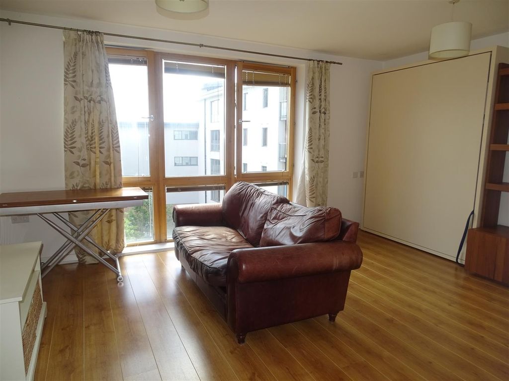 Property photo 2 of 7 Bright Lounge With Large Windows And Sofa...