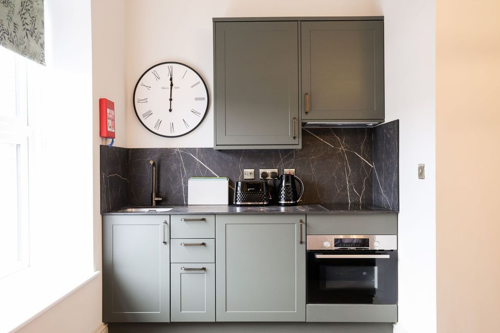 Property photo 3 of 9 Modern Kitchen With Sleek Sage Units And Marble Sp...