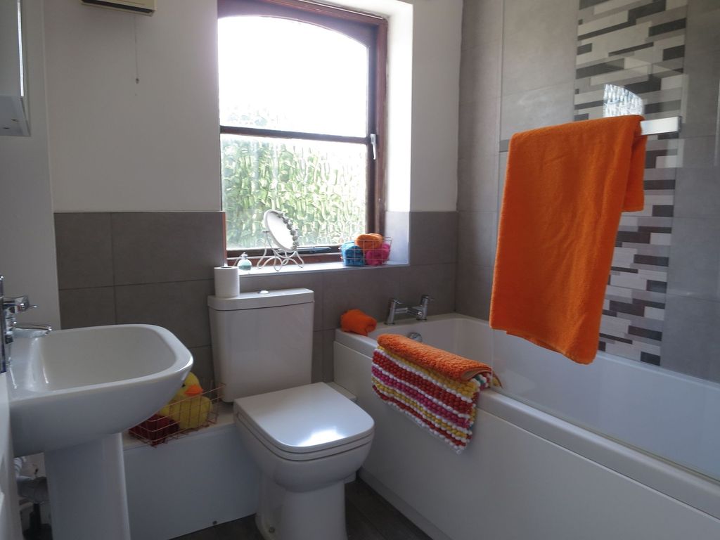 Property photo 2 of 9 Bright And Well-Maintained Bathroom Featuring A Ba...