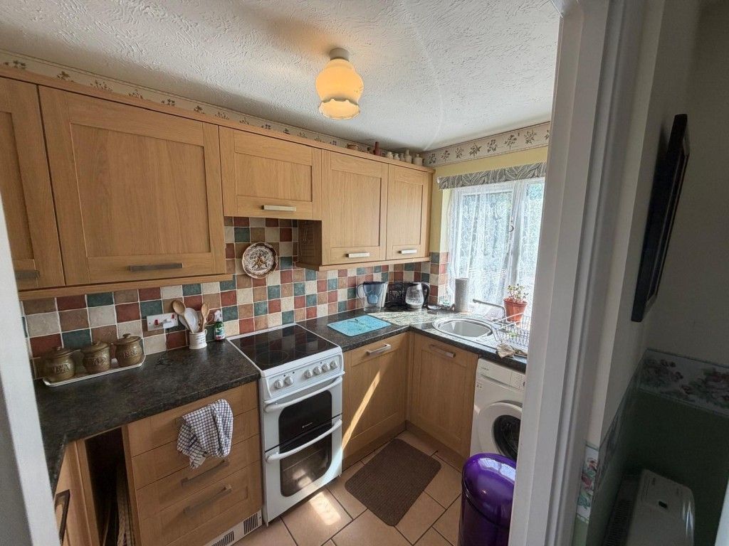 Property photo 2 of 10 Kitchen With Brown Cupboards And Laminate Work Surfaces