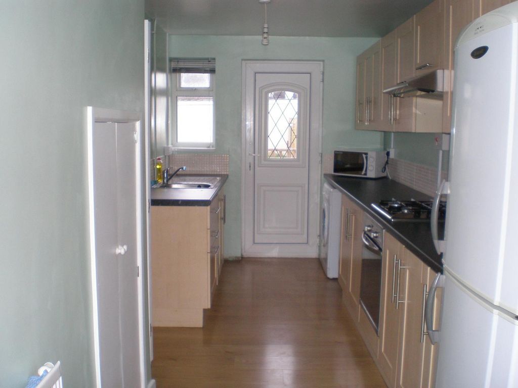 Property photo 2 of 7 A Well-Equipped Kitchen Featuring Modern Cabinetry...