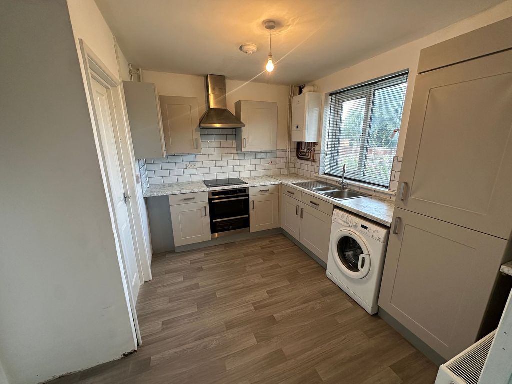 Property photo 1 of 15 Bright And Modern Kitchen Featuring Ample Cabinetr...