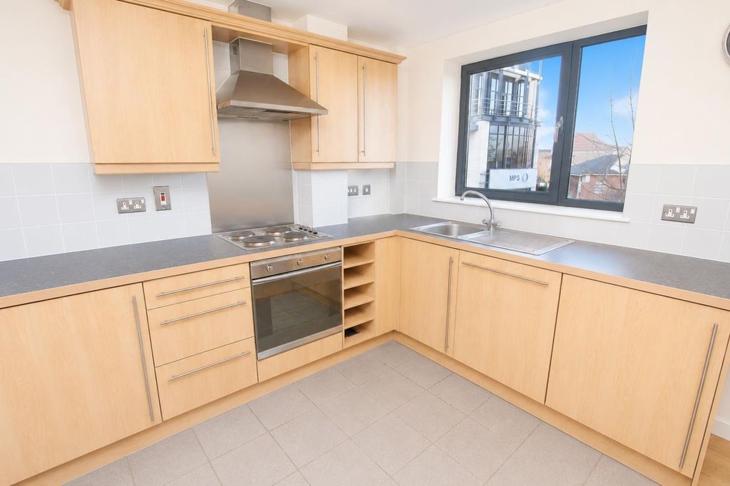 Property photo 2 of 9 Bright Kitchen With Ample Workspace And Storage...