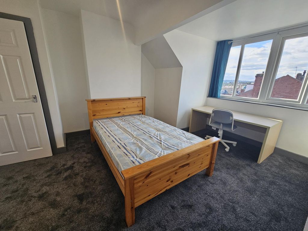 Property photo 2 of 11 Bright And Inviting Master Bedroom Featuring A Lar...