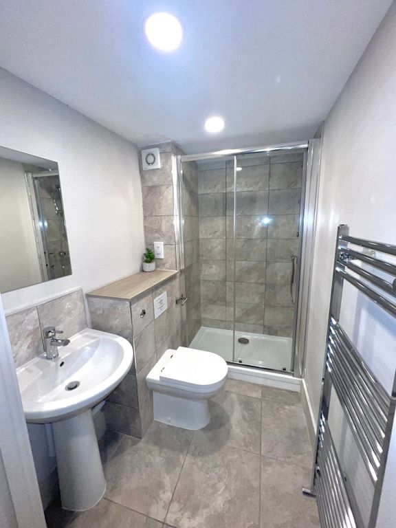 Property photo 3 of 3 This Modern Bathroom Features A Sleek Design With ...