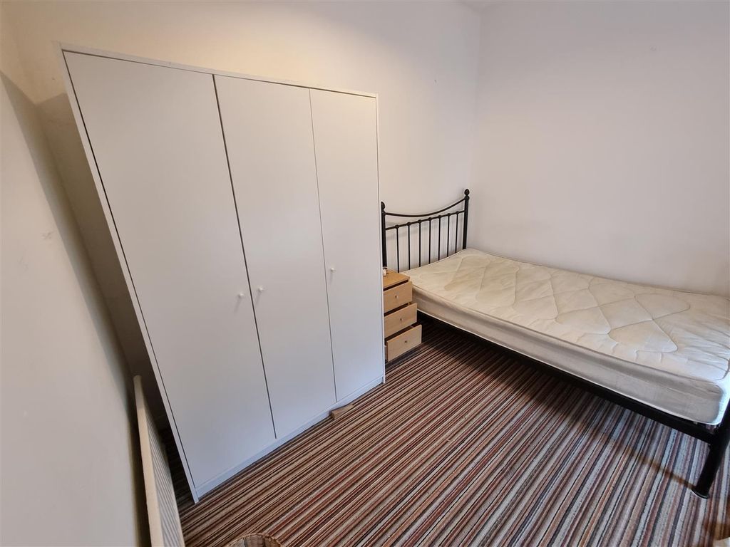 Property photo 3 of 5 Bright Bedroom With Ample Storage And Cozy Bed...