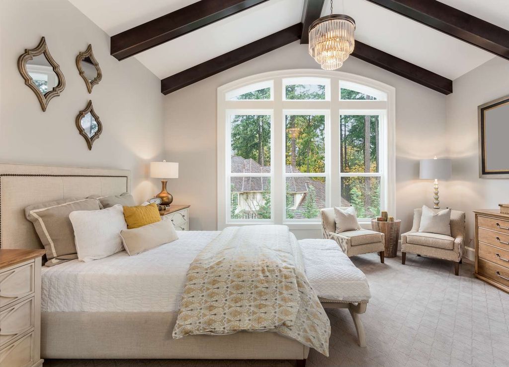 Property photo 2 of 4 Elegant Master Bedroom With A Large, Airy Window A...
