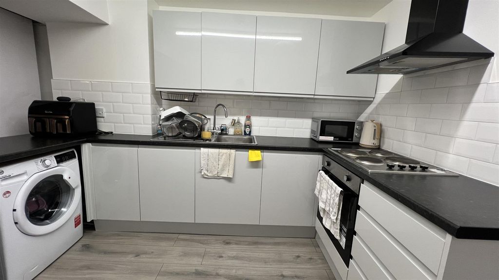 Property photo 2 of 12 Modern Kitchen With Sleek Gloss Cabinetry...